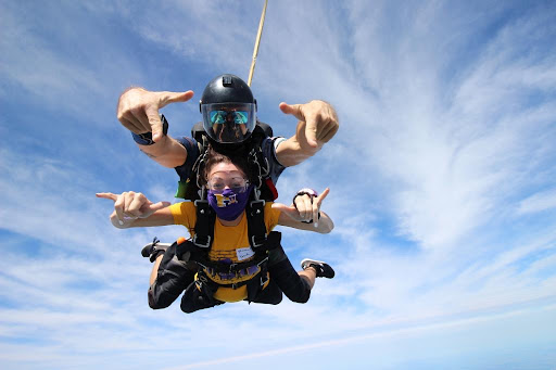 Ms. Burczyk skydiving with her instructure